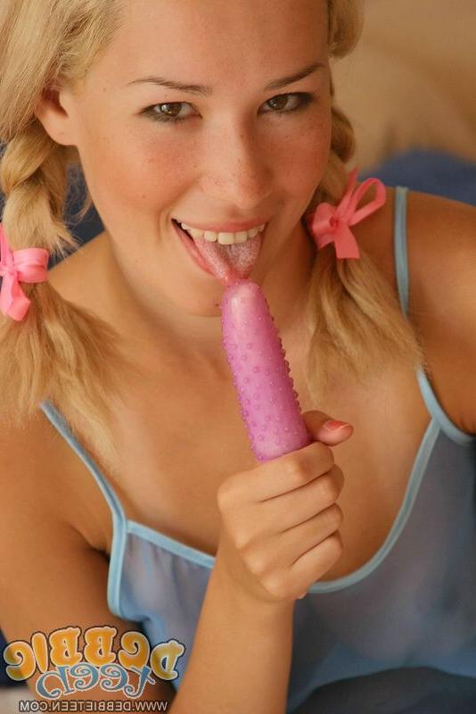 15P Gorgeous blonde plays with a vibrator with her hair in braided pigtails
