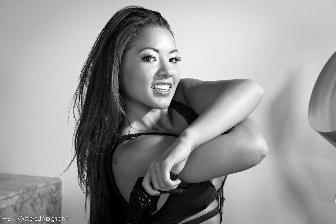 20P Petite Asian Morgan Lee gets rid of her bodysuit and exposes her big booty