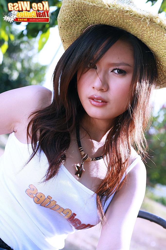 16P Beautiful Thai girl Kee Wisa eats a banana after getting naked on a tractor