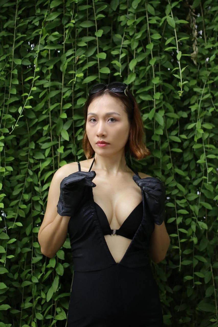 20P Marvelous Asian babe Julia Ly Ly poses in her provocative black dress outside