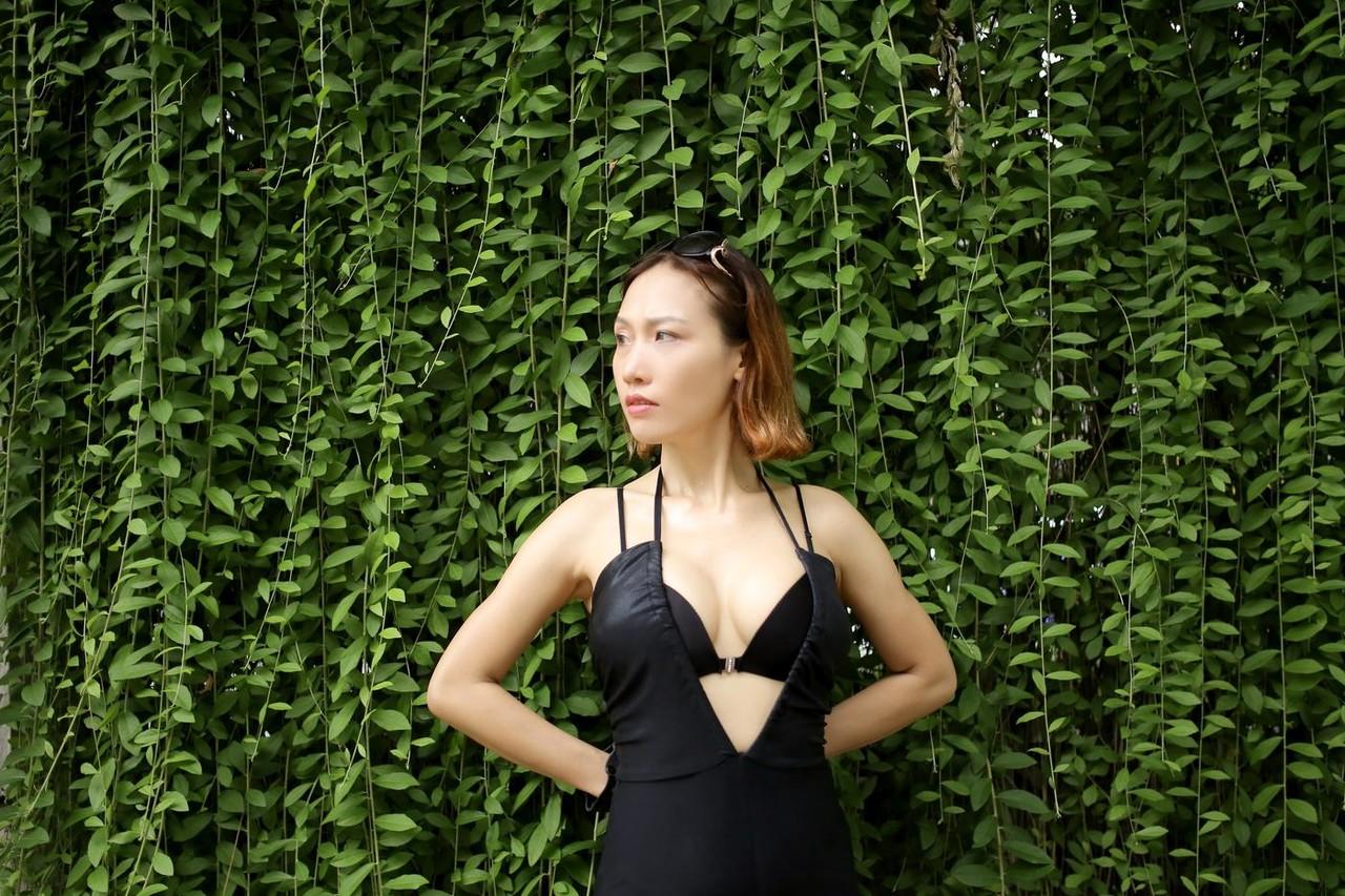 20P Marvelous Asian babe Julia Ly Ly poses in her provocative black dress outside
