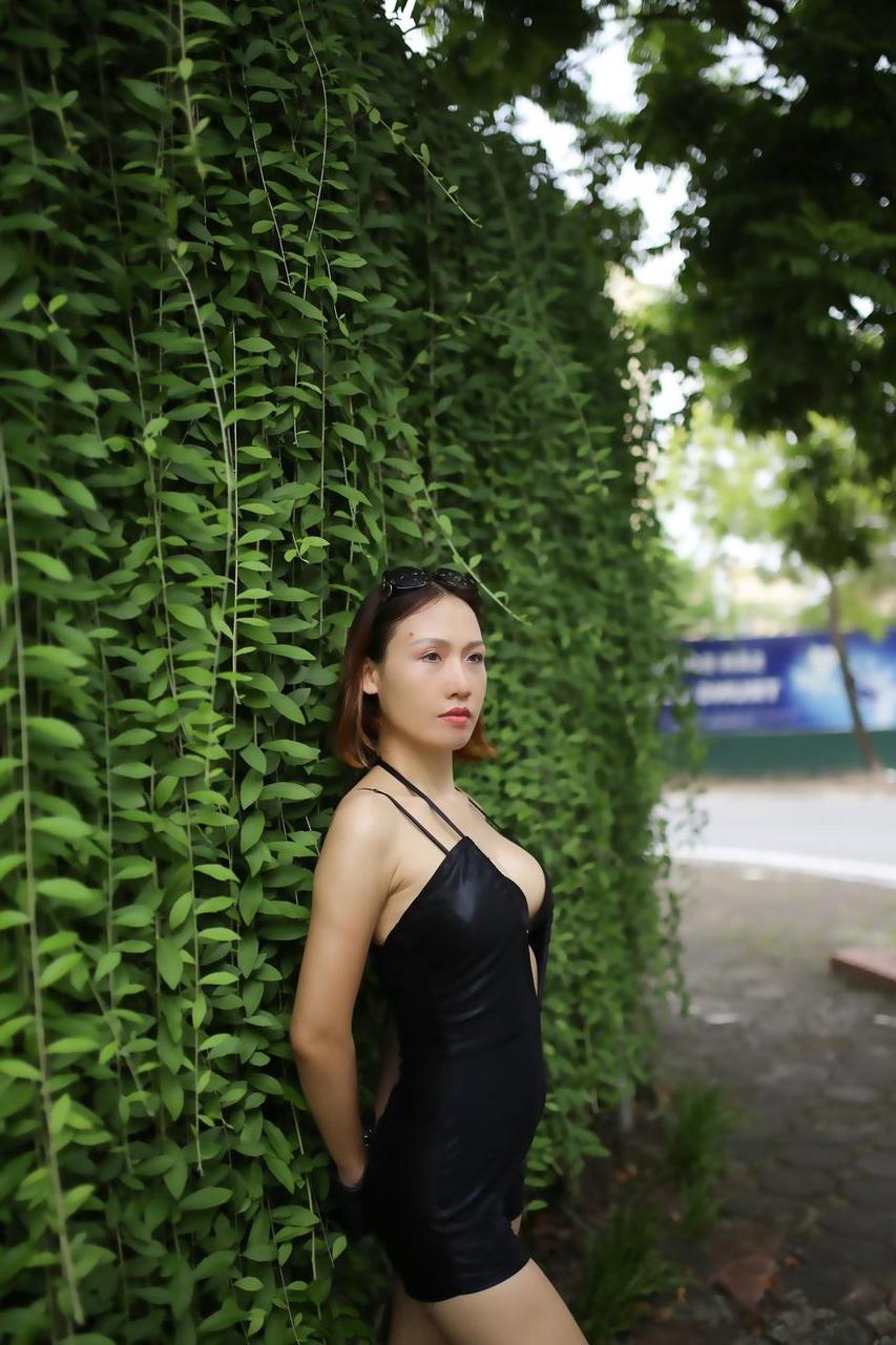 20P Marvelous Asian babe Julia Ly Ly poses in her provocative black dress outside