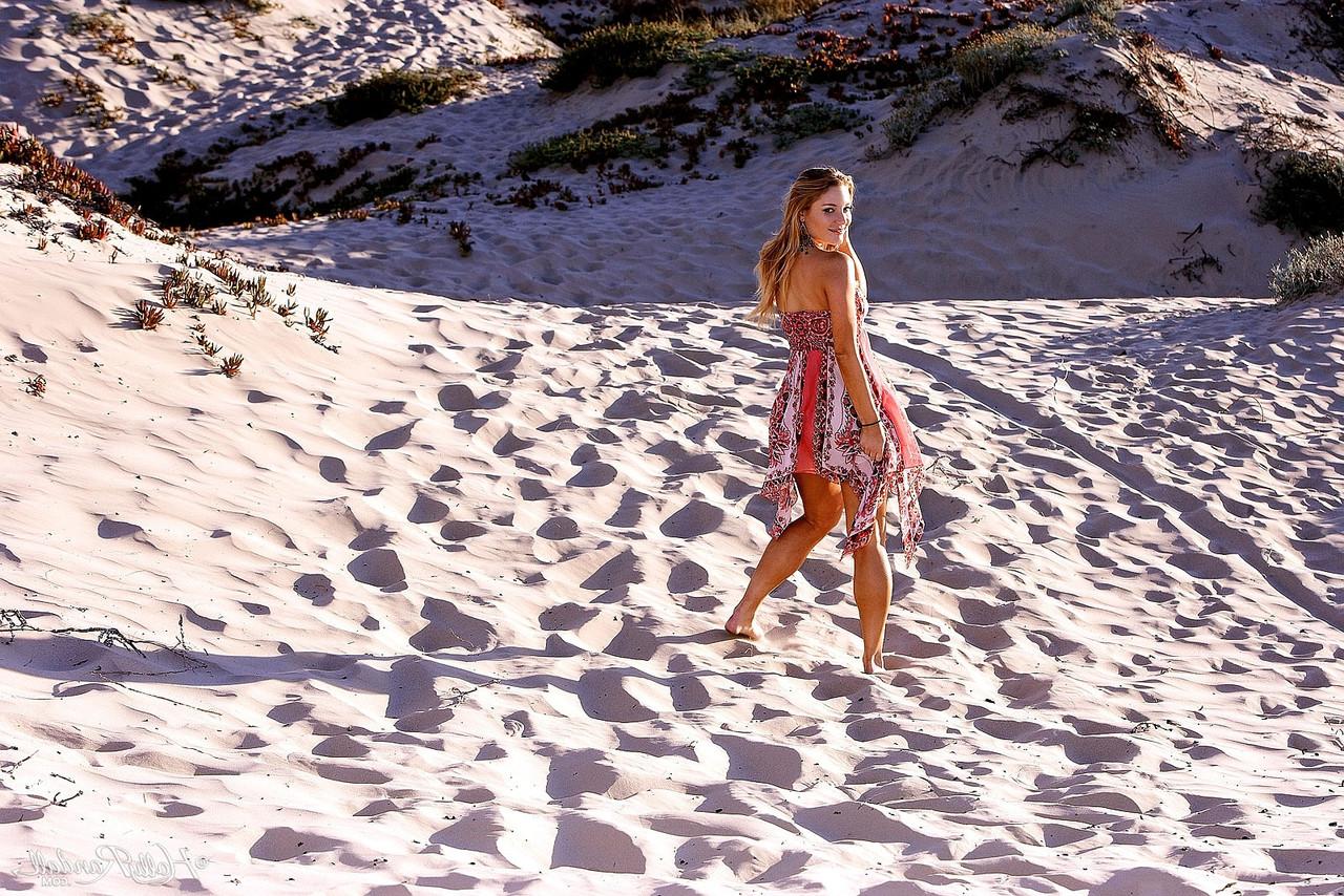 20P Blond Aurora Snow showing natural tits and sweet pussy on the beach