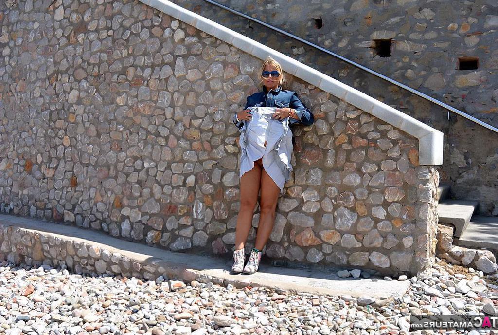 20P Mature fatty Chrissy walks by the sea with her round big tits bared