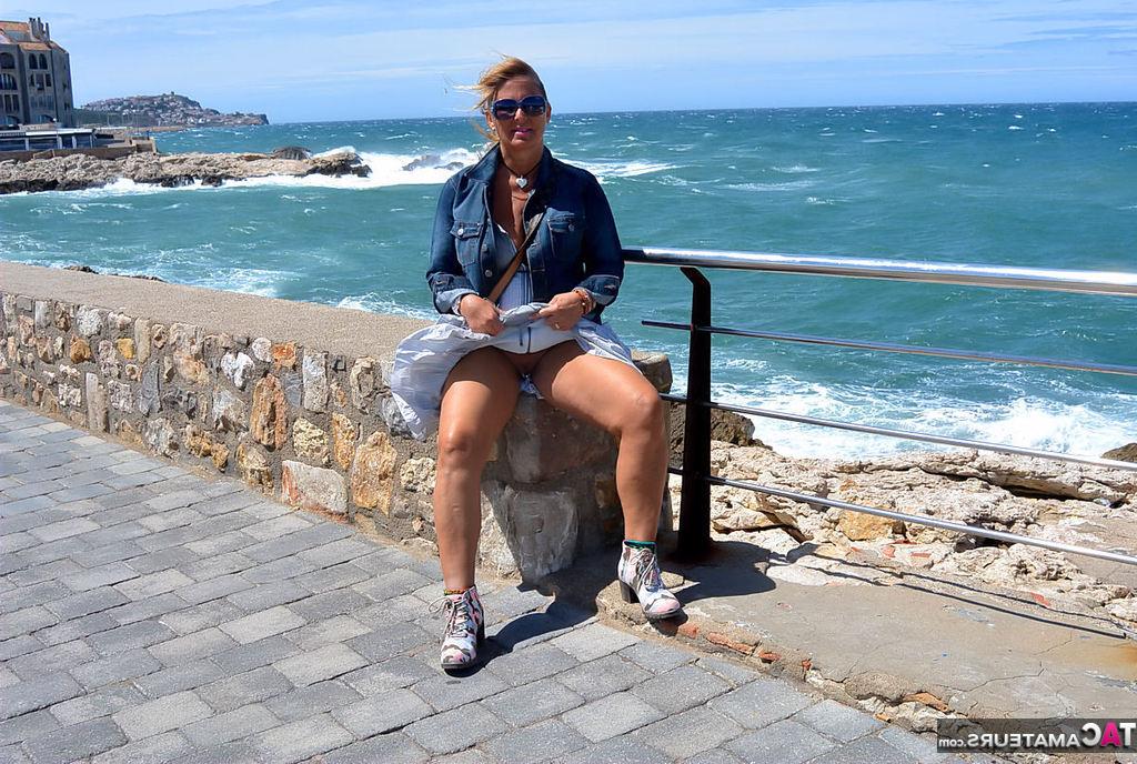 20P Mature fatty Chrissy walks by the sea with her round big tits bared