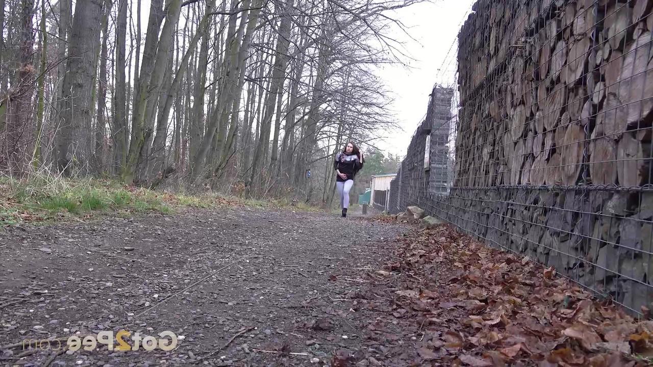 15P Caucasian girl Lara Fox pulls down her pants to pee on a stone dust path