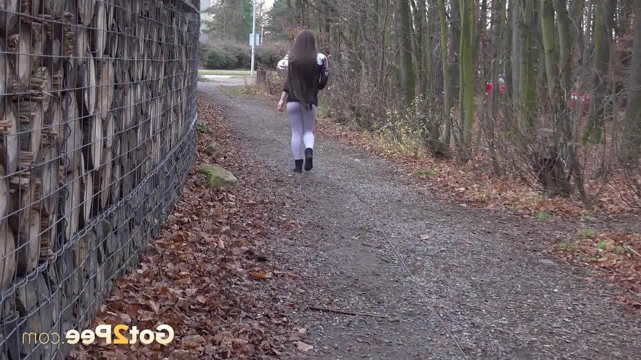 15P Caucasian girl Lara Fox pulls down her pants to pee on a stone dust path