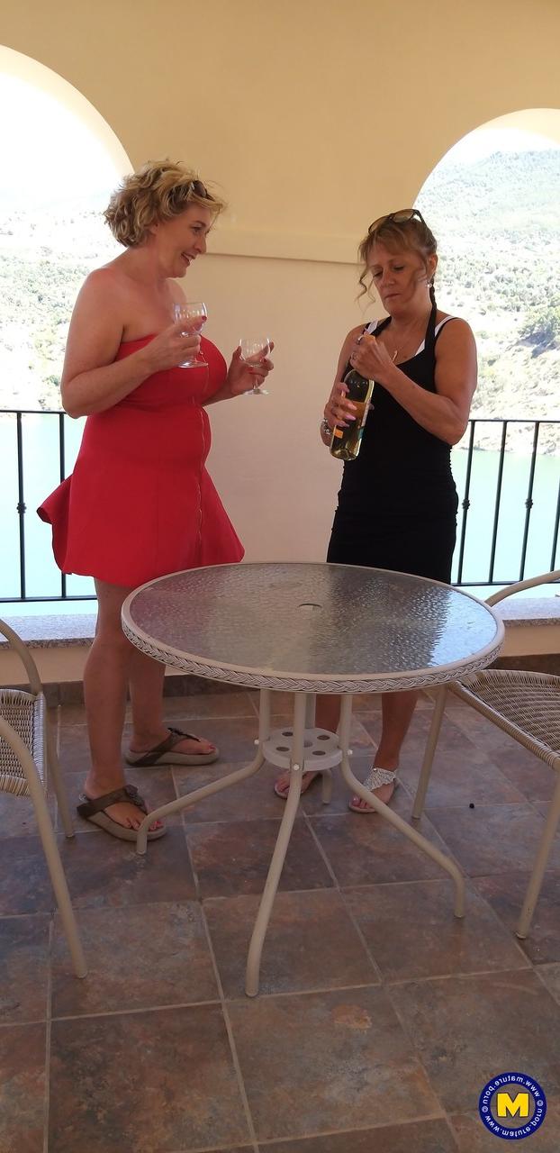 20P Curvaceous mature lesbians Camilla C & Pandora drinking wine on vacation