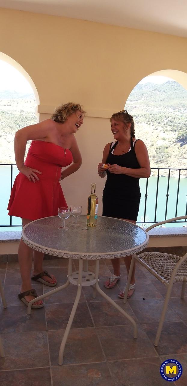 20P Curvaceous mature lesbians Camilla C & Pandora drinking wine on vacation