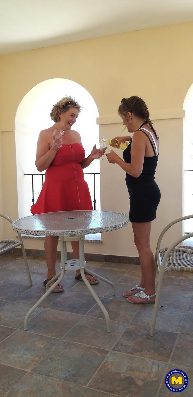 20P Curvaceous mature lesbians Camilla C & Pandora drinking wine on vacation