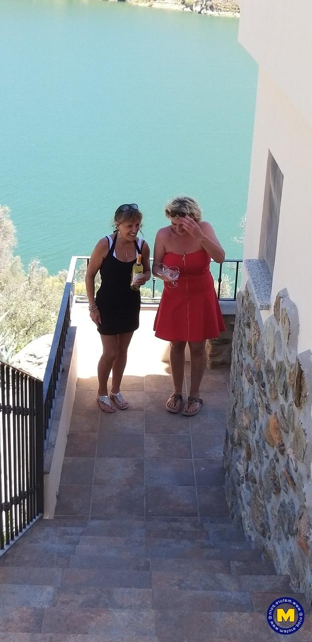 20P Curvaceous mature lesbians Camilla C & Pandora drinking wine on vacation