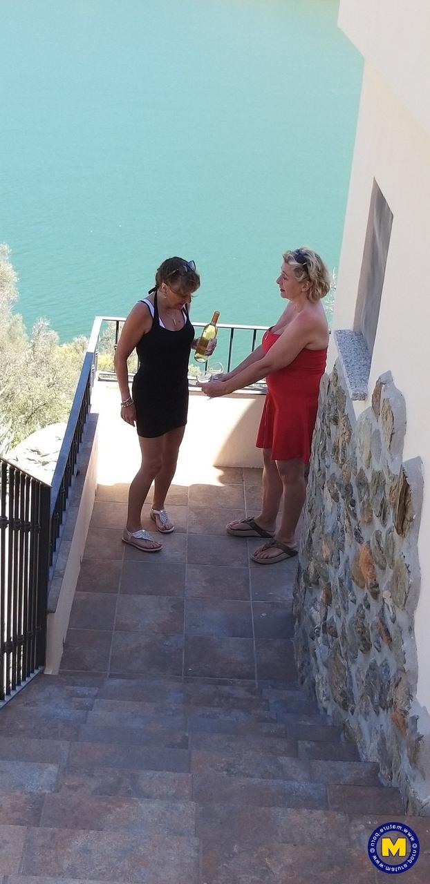 20P Curvaceous mature lesbians Camilla C & Pandora drinking wine on vacation