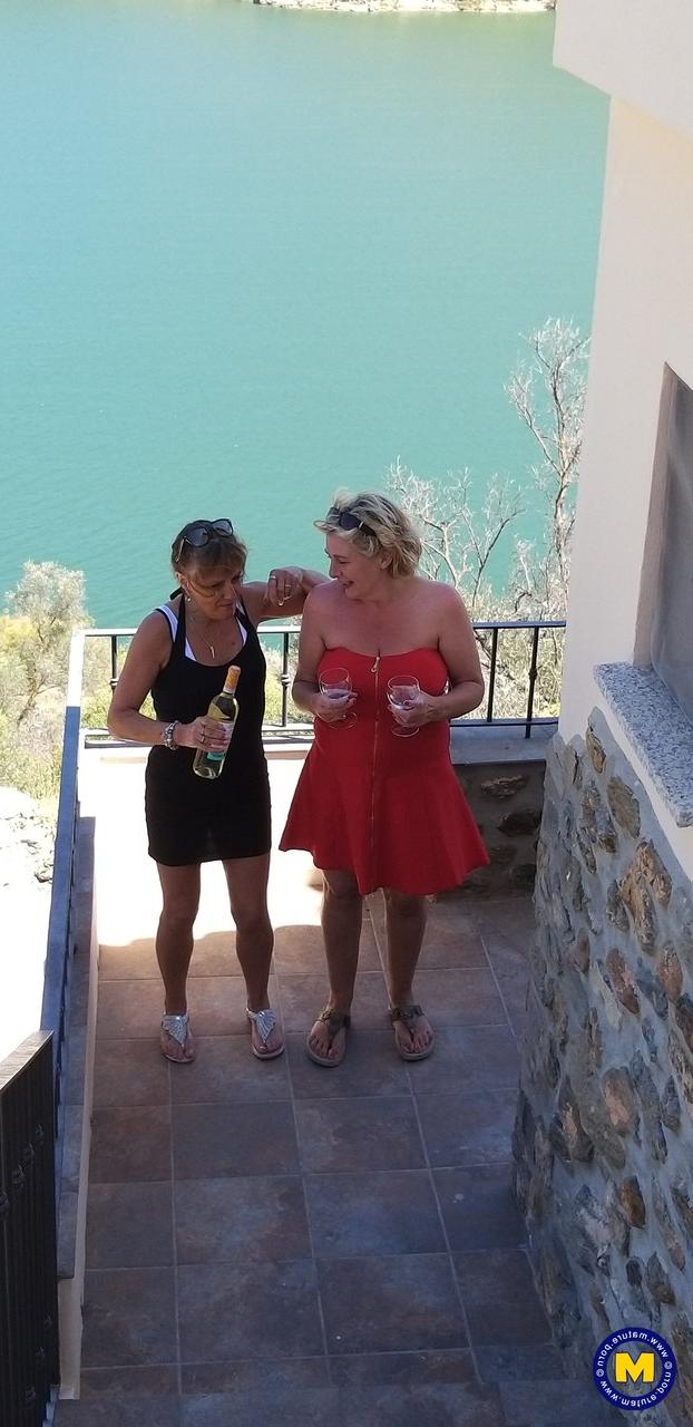 20P Curvaceous mature lesbians Camilla C & Pandora drinking wine on vacation