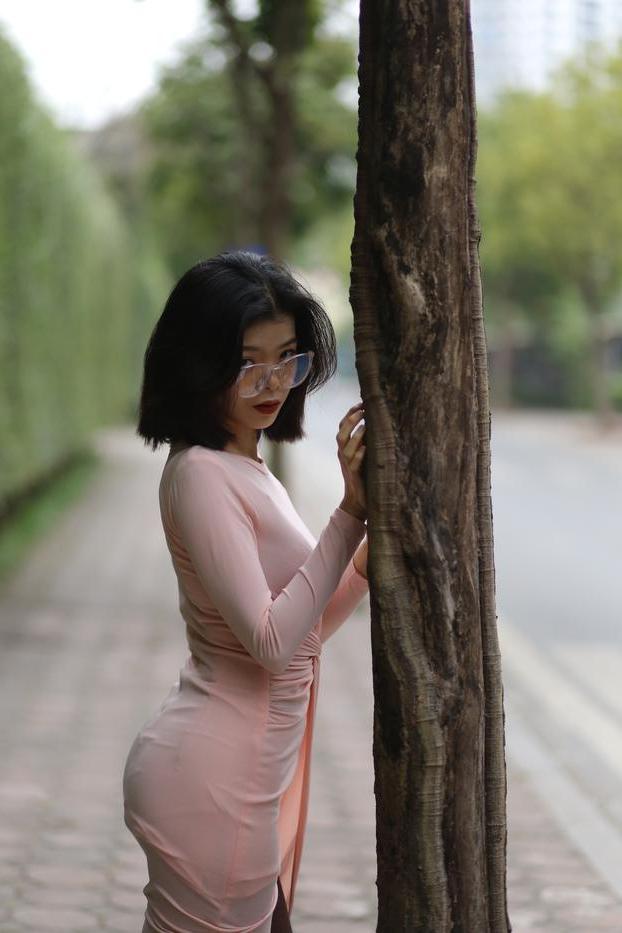 20P Breathtaking Asian model Irena posing in her sexy tight outfit outdoors