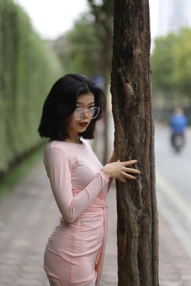20P Breathtaking Asian model Irena posing in her sexy tight outfit outdoors