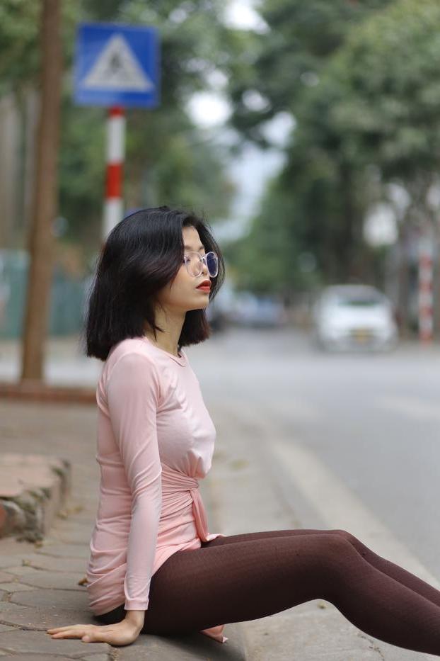 20P Breathtaking Asian model Irena posing in her sexy tight outfit outdoors