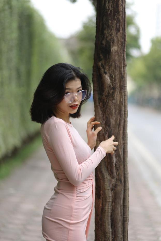 20P Breathtaking Asian model Irena posing in her sexy tight outfit outdoors