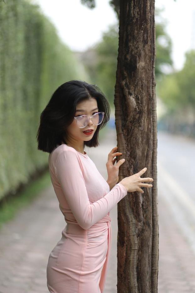 20P Breathtaking Asian model Irena posing in her sexy tight outfit outdoors