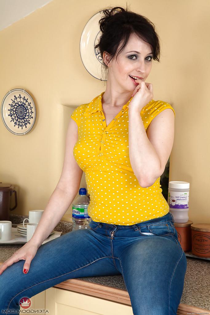 16P Middle aged lady Nikita pulling down jeans and panties for hairy pussy display