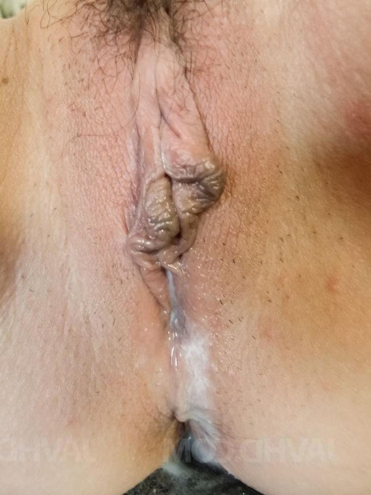 15P Japanese MILF Mei Naomi gets spit roasted on a bed after being masturbated