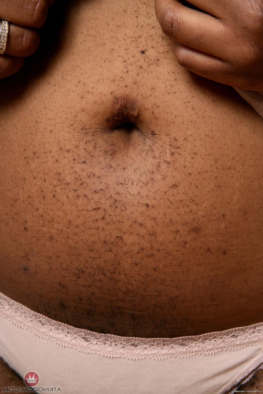 20P Ebony fatty Misty unleashes her big tits and spreads her furry cunt
