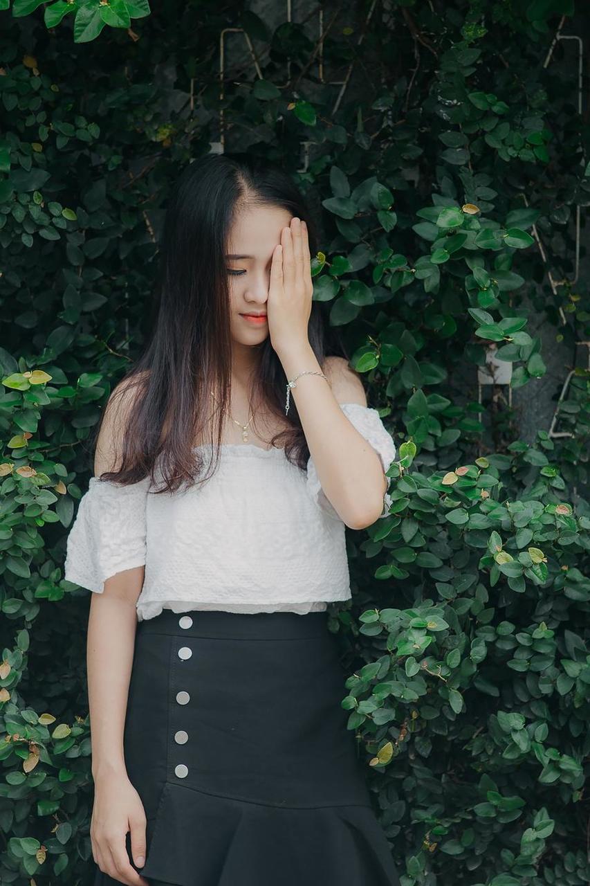 20P Innocent Asian model posing in her top, skirt and shoes outdoors