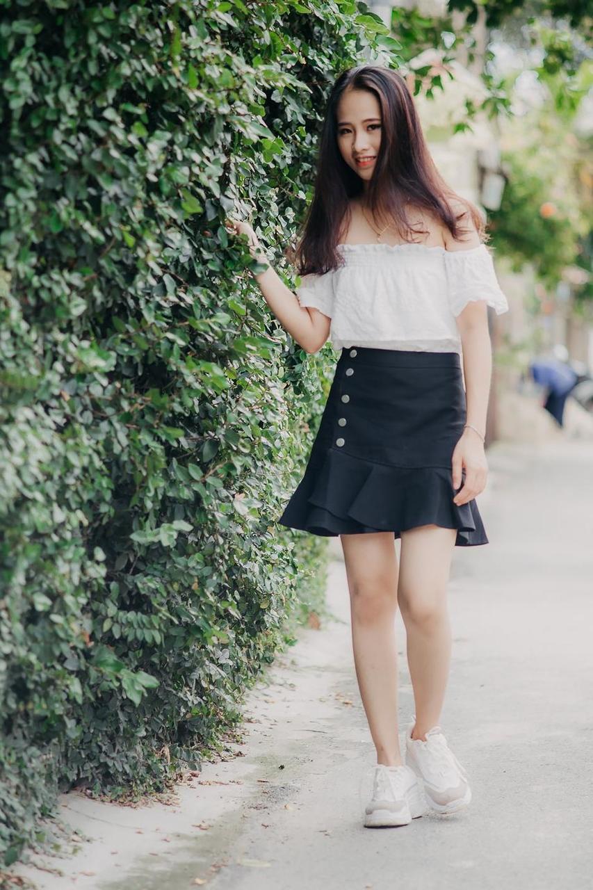 20P Innocent Asian model posing in her top, skirt and shoes outdoors