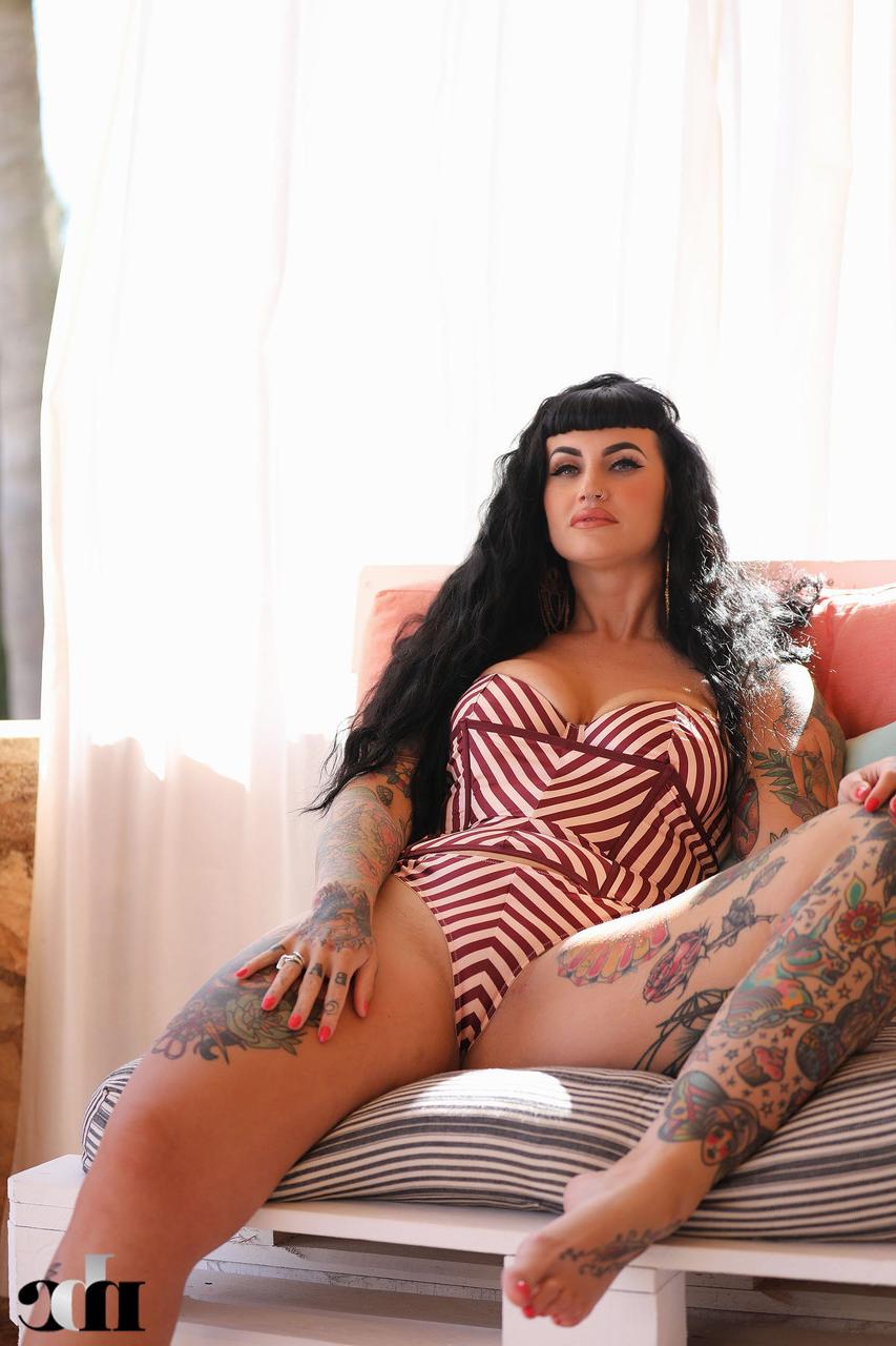 20P Chubby inked model Cherrie Pie exposes her pierced big tits and fat ass