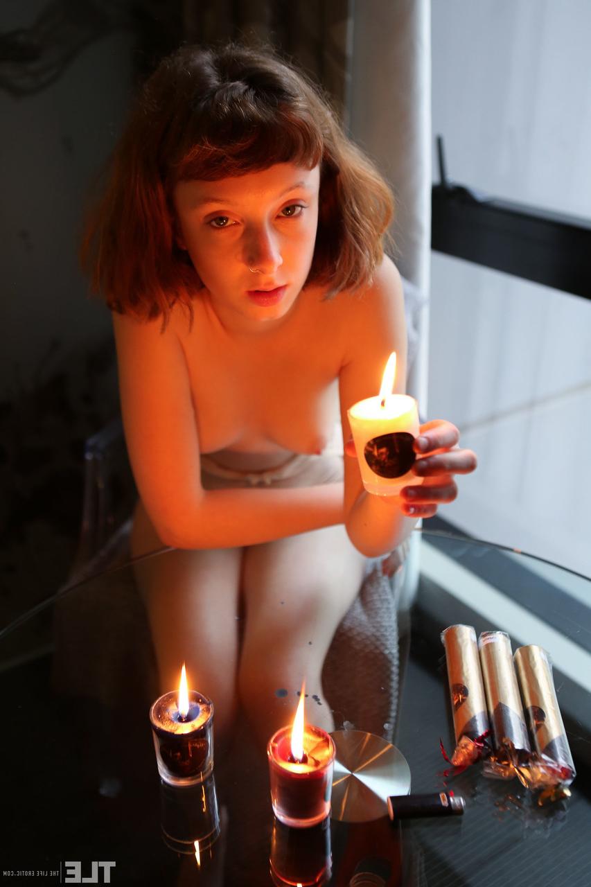 20P Teen with small tits Sondrine rubs her hairy twat after playing with wax