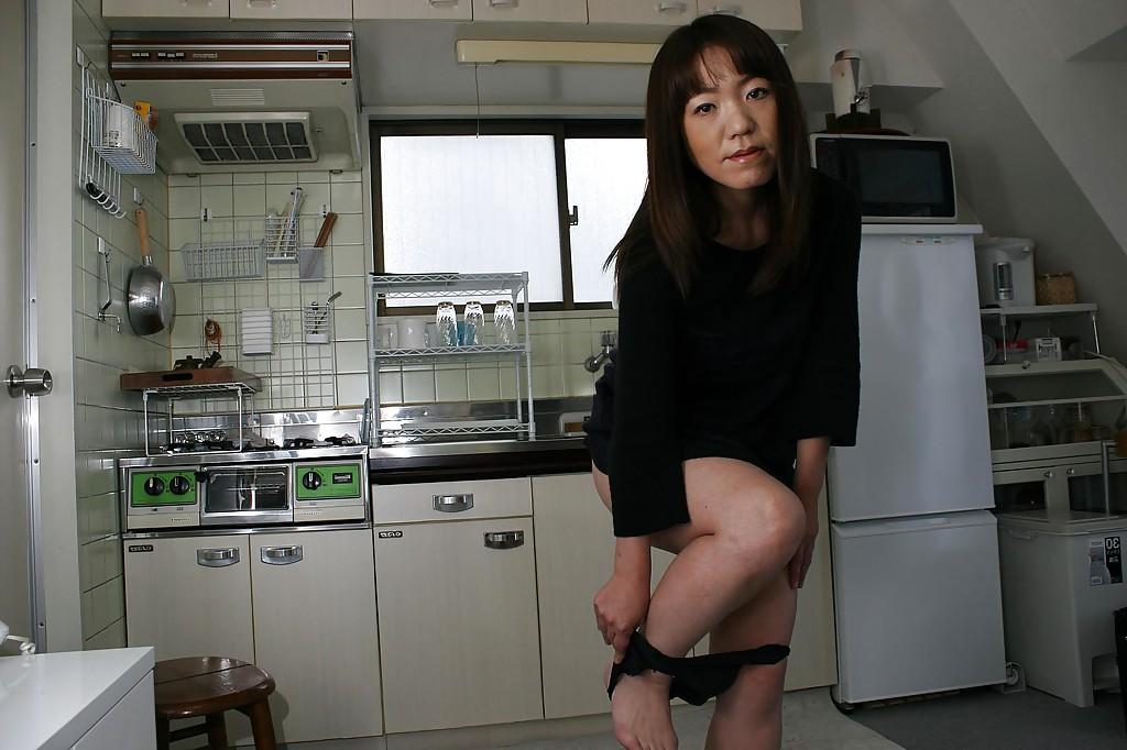 16P Upskirt posing scene of an astonishing Asian milf in lingerie Kazue Hamano