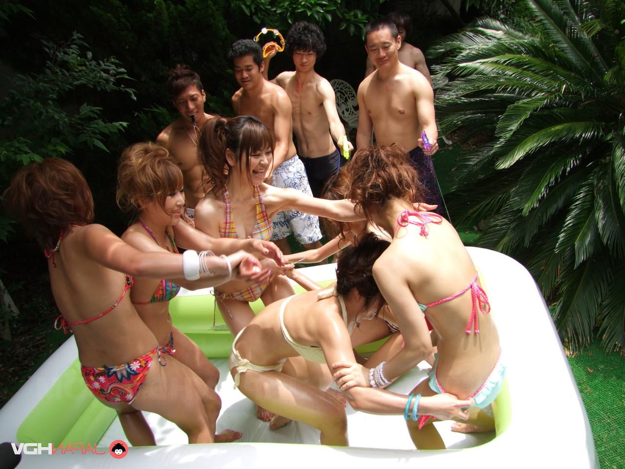 20P Japanese babes in bikinis stripping and having fun in a small outdoor pool