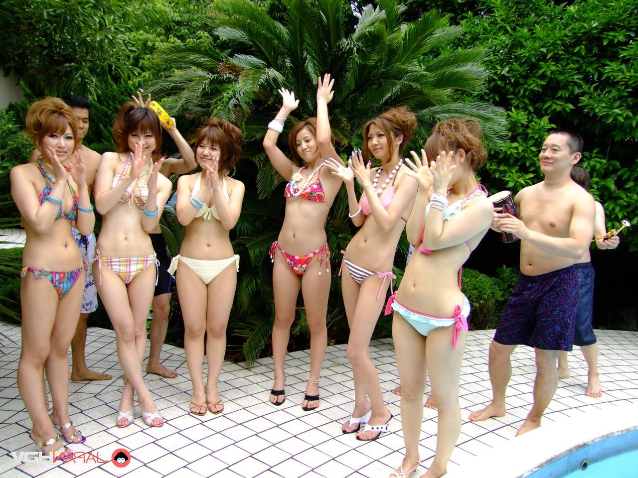20P Japanese babes in bikinis stripping and having fun in a small outdoor pool