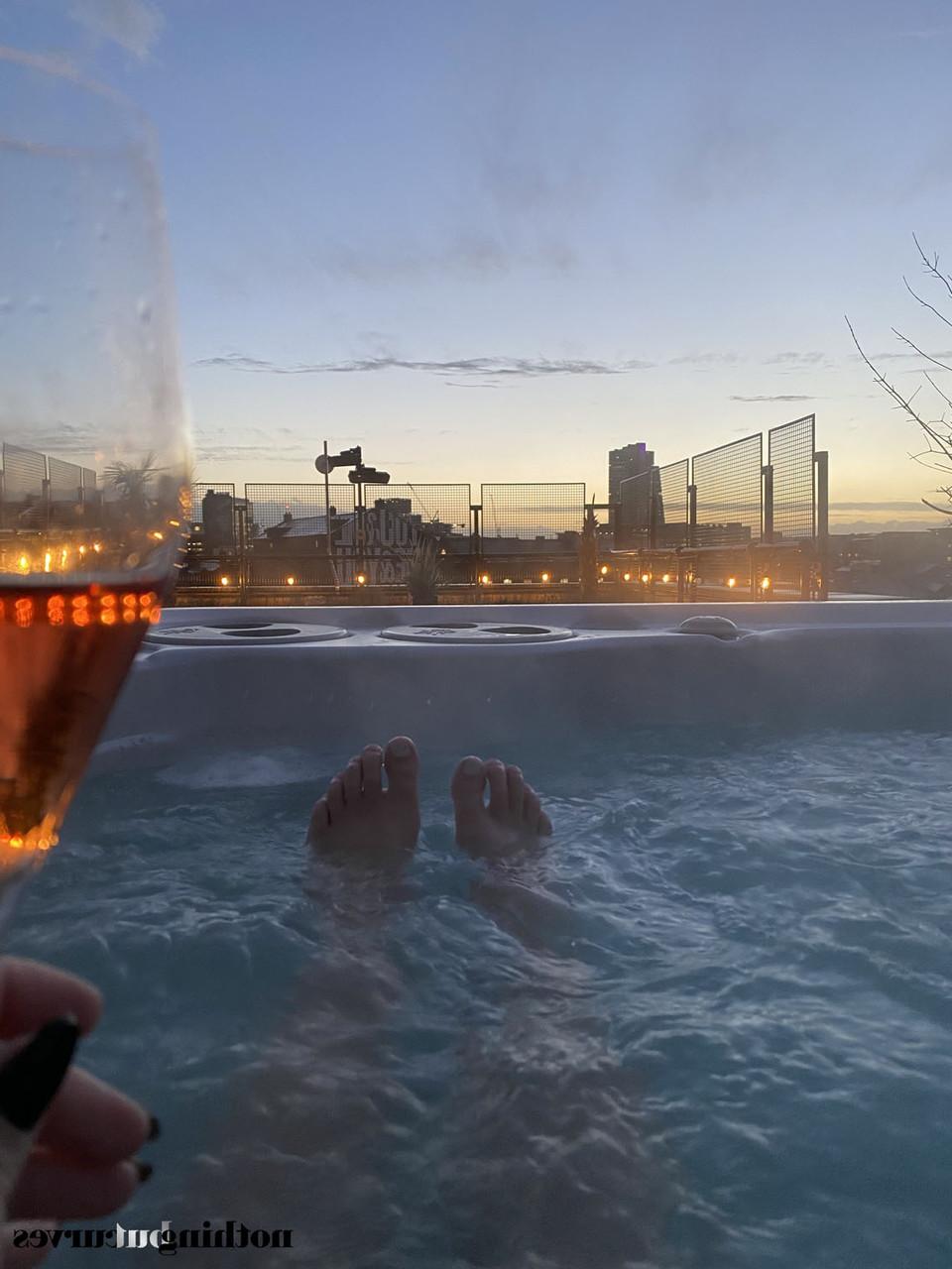 20P Pretty redheaded babe Lucy Vixen shows her grand juggs in the rooftop jacuzzi