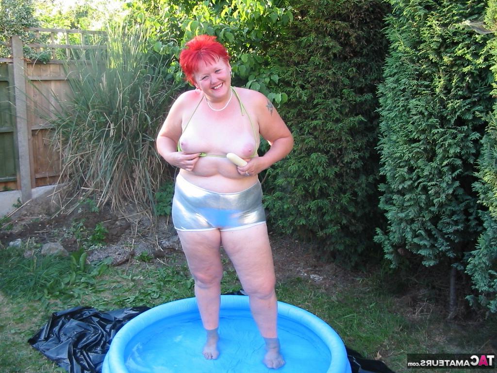 16P Older redheaded BBW Valgasmic Exposed plays with a dildo in a wading pool