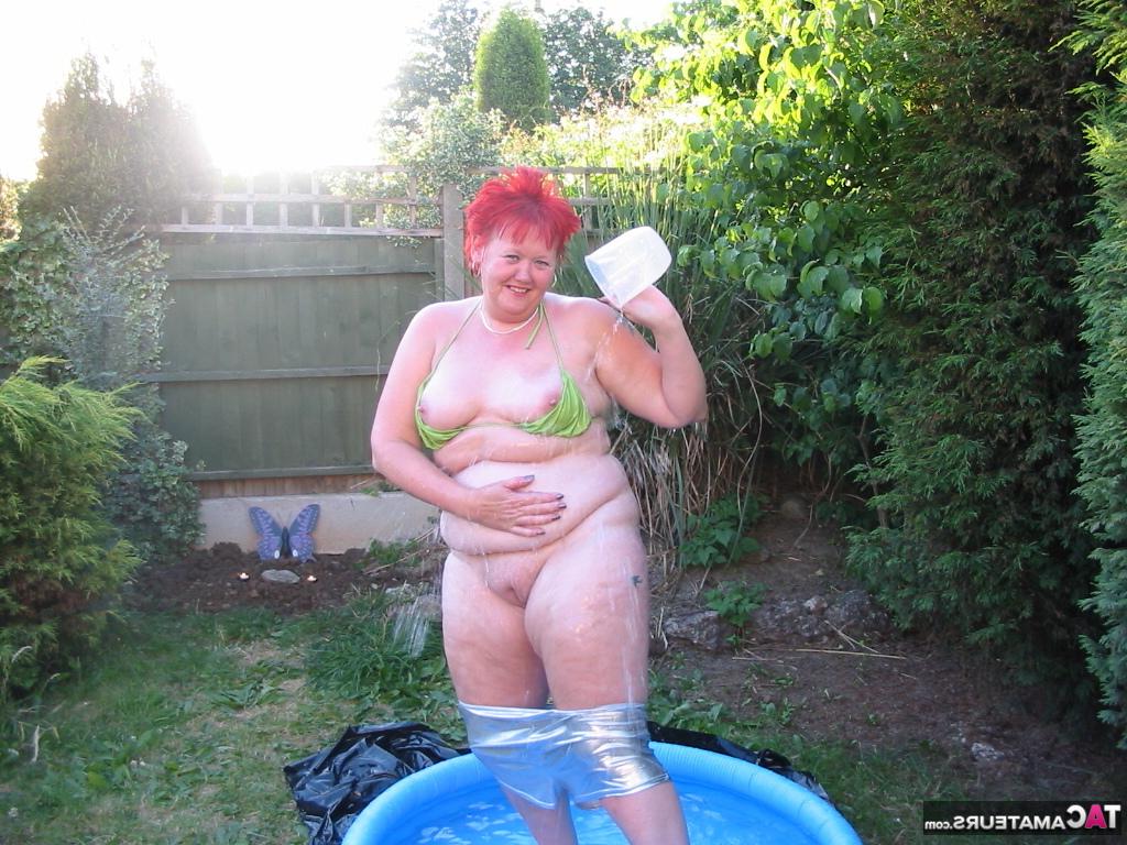 16P Older redheaded BBW Valgasmic Exposed plays with a dildo in a wading pool
