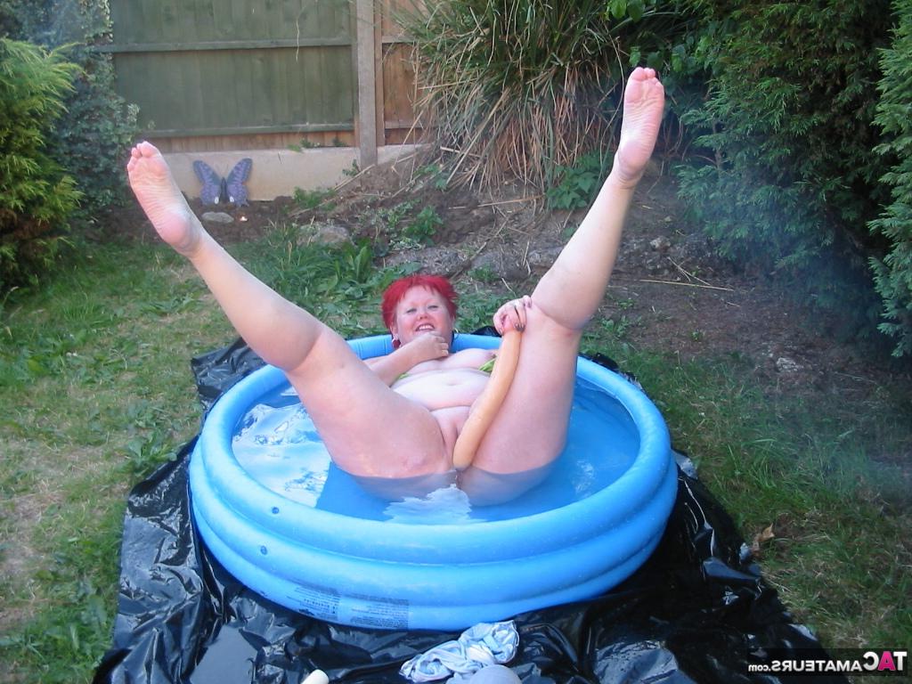 16P Older redheaded BBW Valgasmic Exposed plays with a dildo in a wading pool