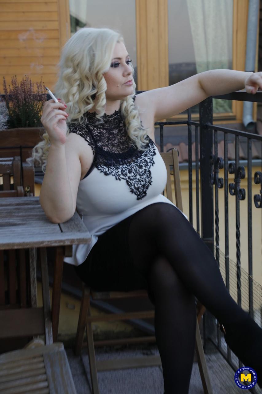 20P Blonde Czech MILF Alexa Bold teases with her big tits while smoking outdoors