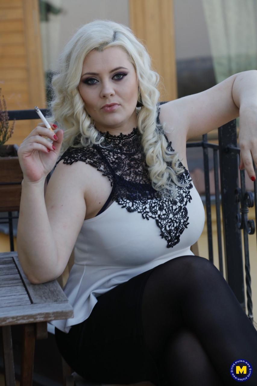 20P Blonde Czech MILF Alexa Bold teases with her big tits while smoking outdoors