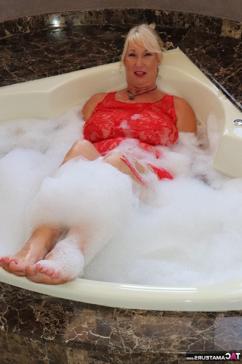 16P Mature fatty Melody gets in a bubble bath while fully clothed