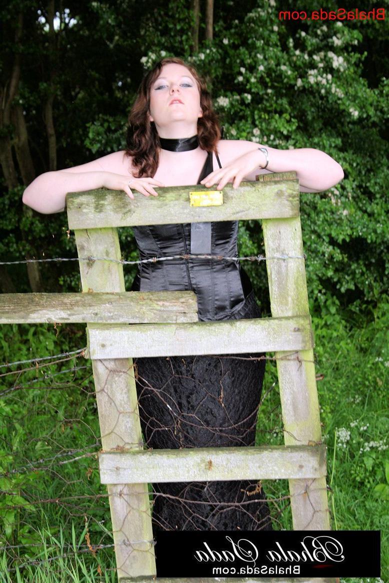15P Chubby brunette MILF posing in an attractive satin and lace outfit in nature