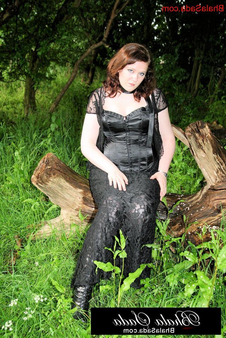 15P Chubby brunette MILF posing in an attractive satin and lace outfit in nature