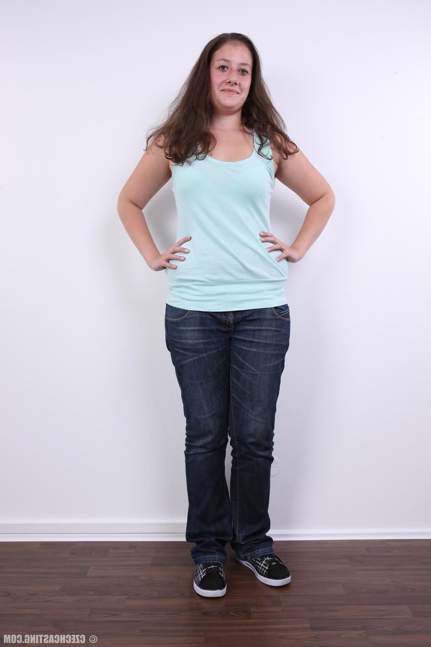 20P Plump girl Klara stands fully clothed before making her totally nude debut