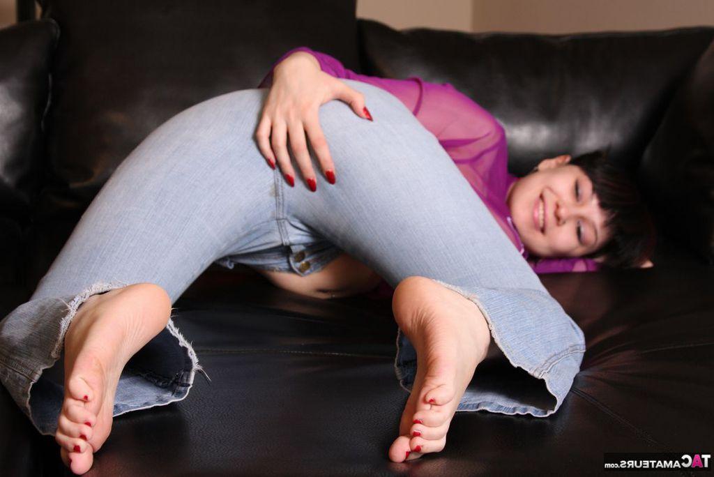 20P Amateur model Susy Rocks strikes tempting poses in a see-thru shirt and jeans