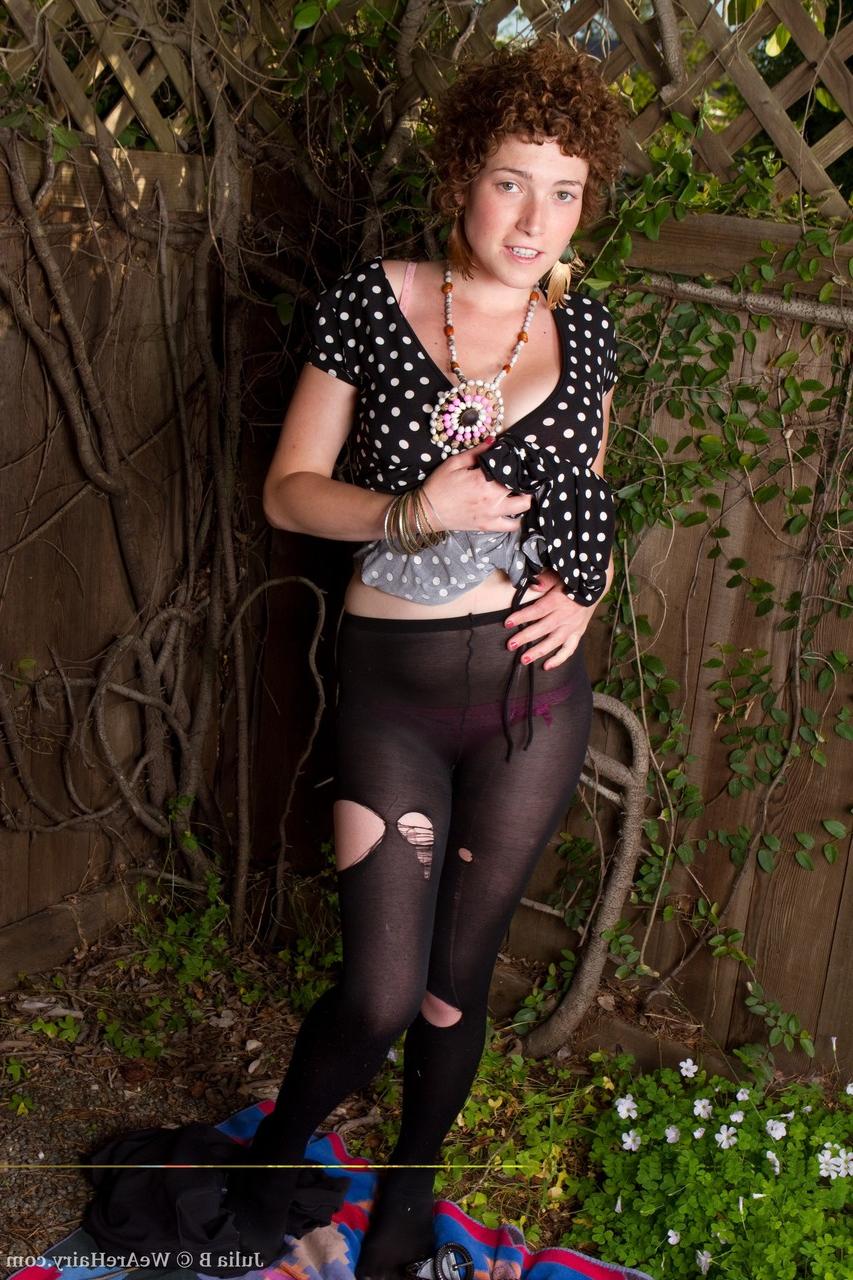 20P Babe in pantyhose Julia B bares her nice breasts & her hairy pussy outdoors