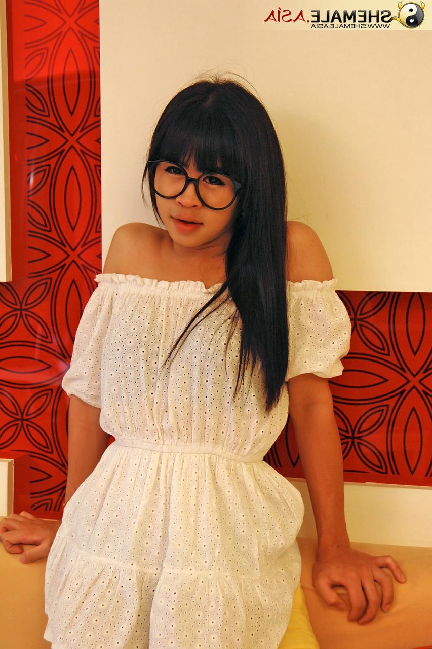 20P Dark haired tranny in glasses Mydeer flaunts her small tits and tasty dick