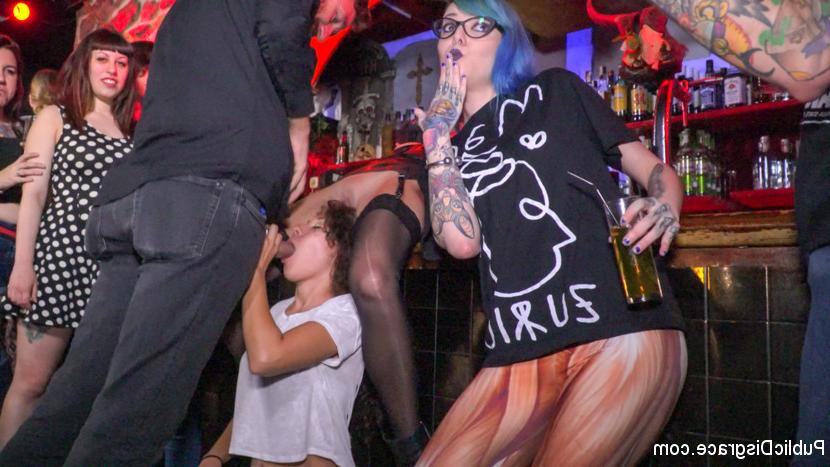 15P Submissive girl is spit roasted in public before sucking cock in a bar