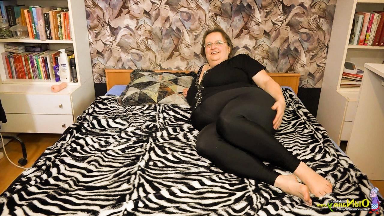 16P Obese granny Othilia gets banged by a young girl that's sporting a strapon