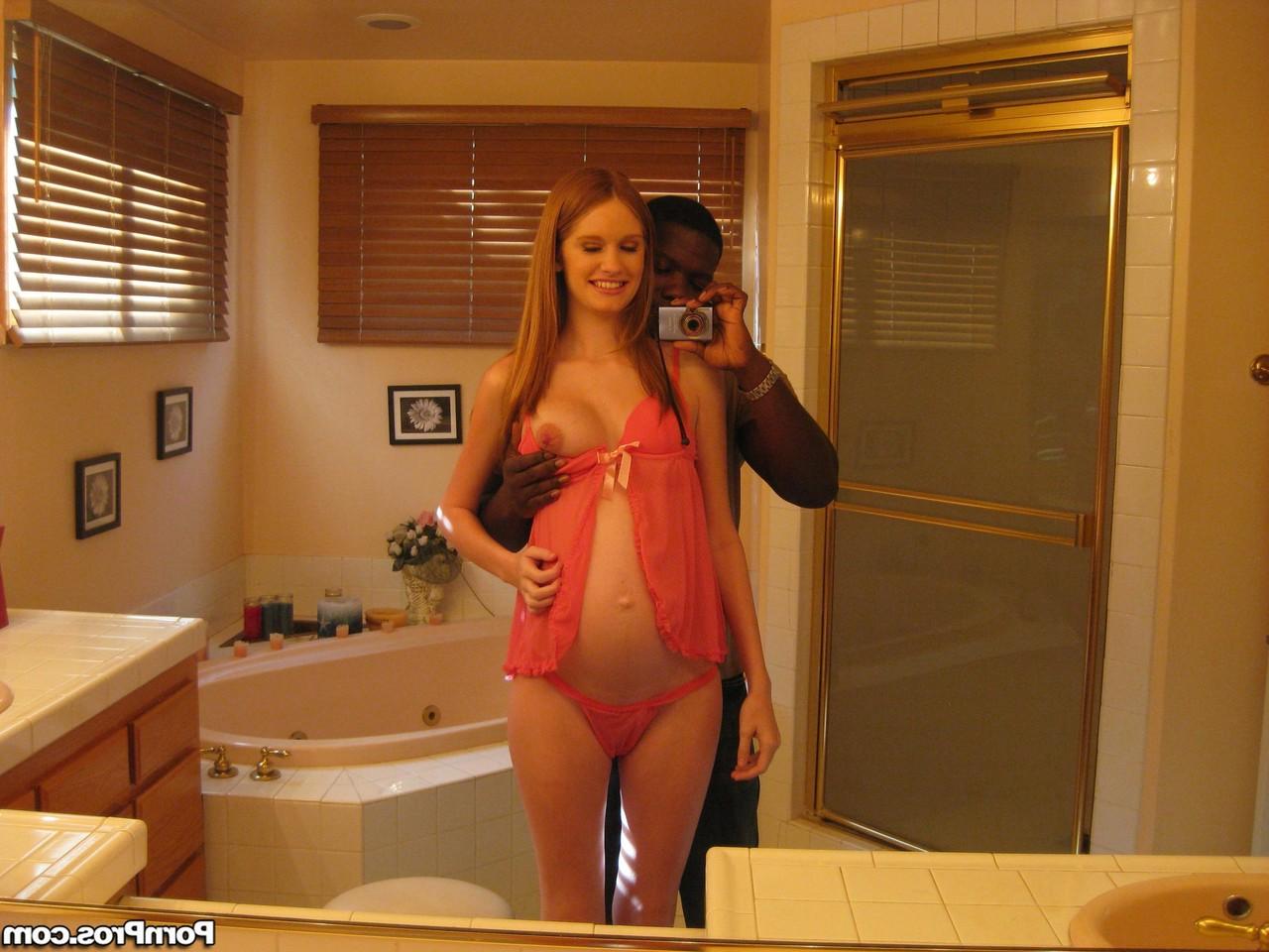 16P Pregnant redhead Layla Exx poses for the photoshoot with black guy