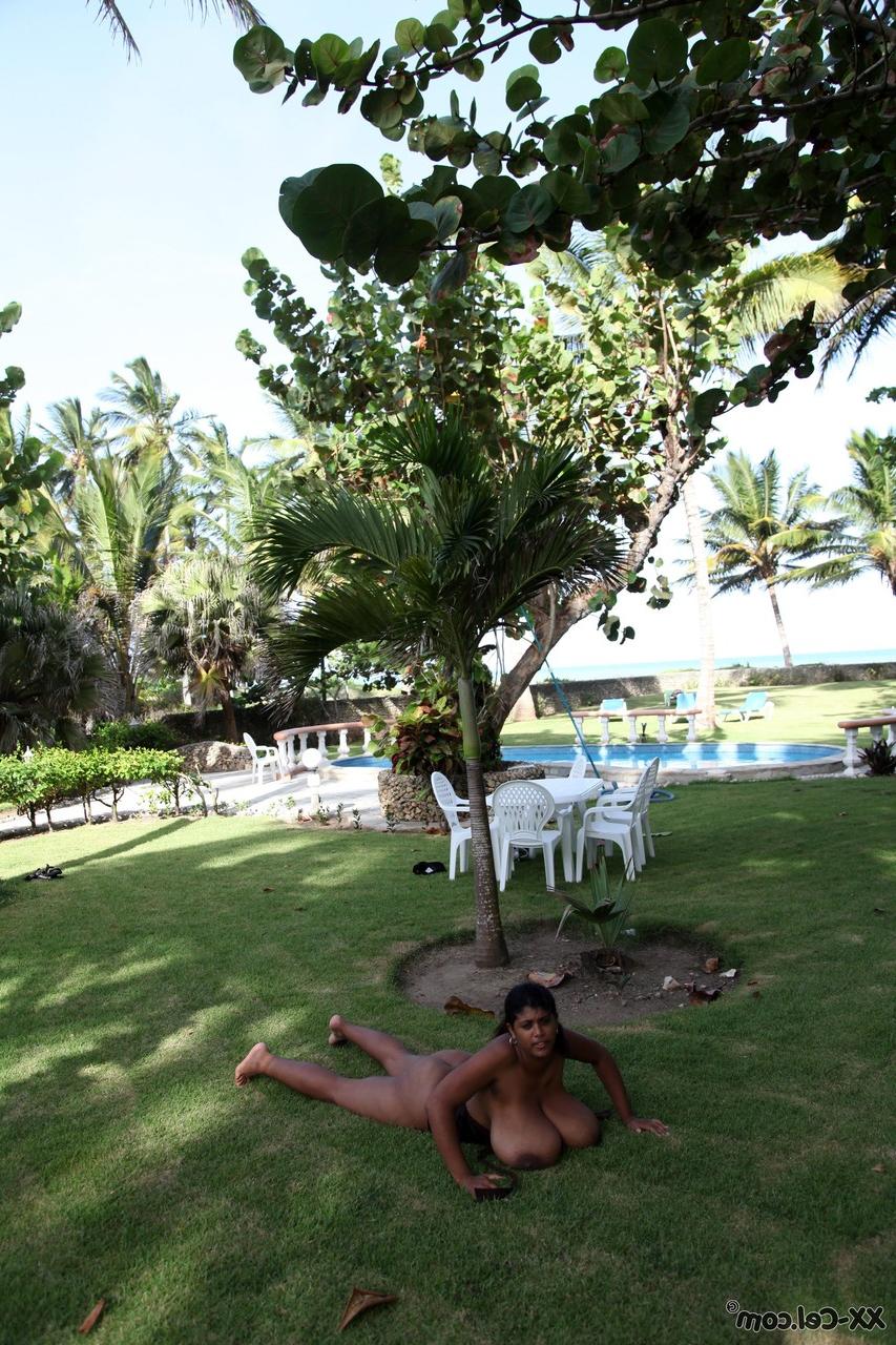 20P Puerto Rican woman Kristina Milan displaying her very big tits outdoors