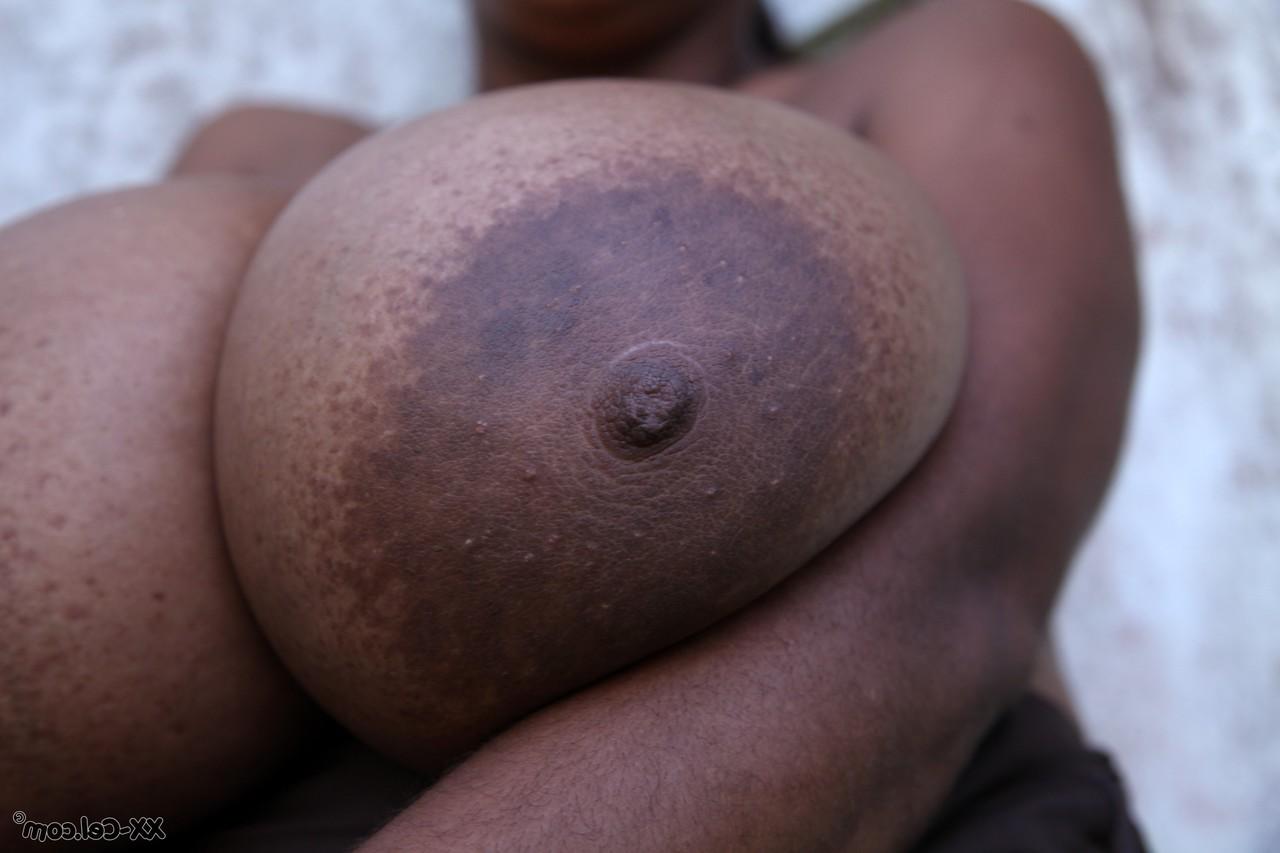 20P Puerto Rican woman Kristina Milan displaying her very big tits outdoors